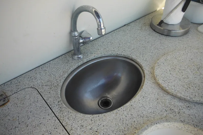 Slide: The Image of Stainless steel sink and faucet on Rinker 330 Fiesta Vee boat, 2000 model. - 28