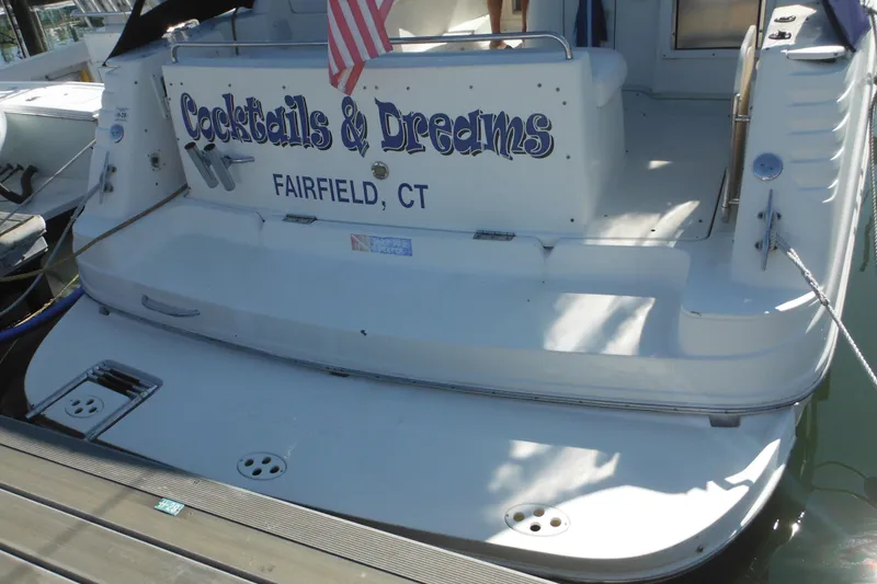 Slide: The Image of 2000 Rinker 330 Fiesta Vee boat docked, named "Cocktails & Dreams," Fairfield, CT. - 3