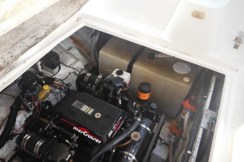 Slide: The Image of Engine compartment of 2000 Rinker 330 Fiesta Vee with MerCruiser components. - 35