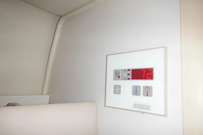Slide: The Image of Digital thermostat display inside 2000 Rinker 330 Fiesta Vee boat cabin, showing 72 degrees. - 45