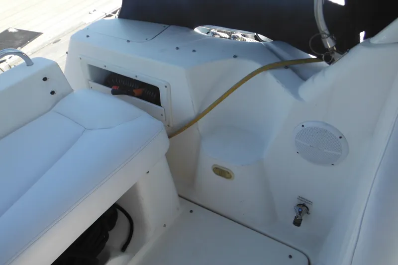 Slide: The Image of Interior view of a 2000 Rinker 330 Fiesta Vee boat with seating and speaker. - 5