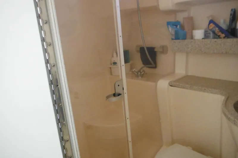 Slide: The Image of Bathroom interior of 2000 Rinker 330 Fiesta Vee boat with shower and sink. - 53