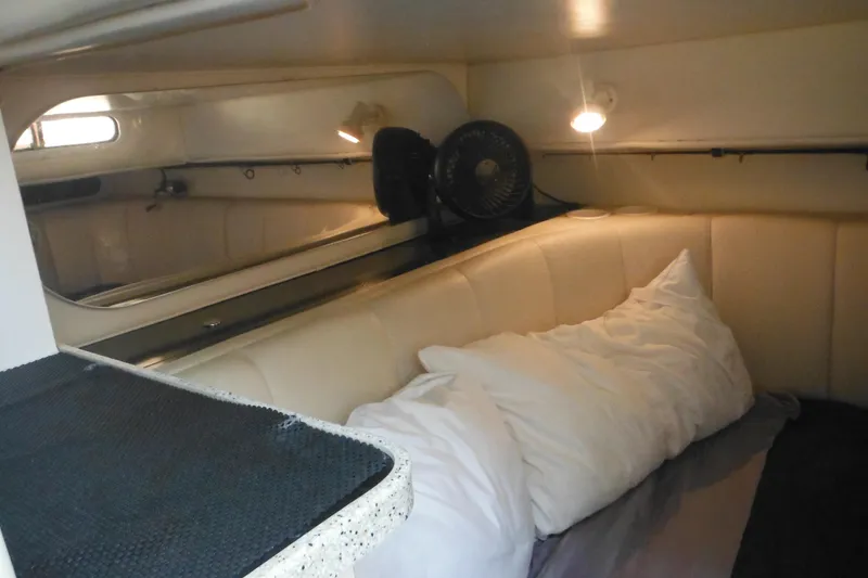 Slide: The Image of Interior cabin of 2000 Rinker 330 Fiesta Vee with cozy seating and lighting. - 58