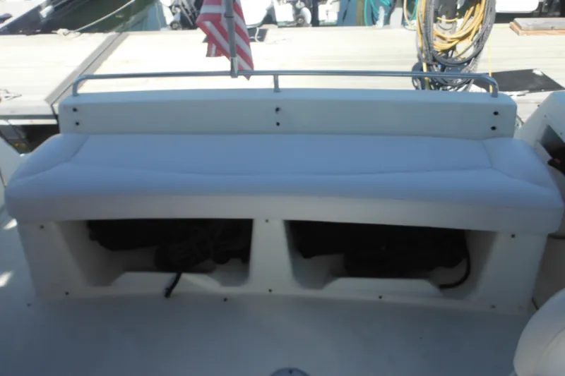 Slide: The Image of 2000 Rinker 330 Fiesta Vee boat seating area with storage compartments. - 6