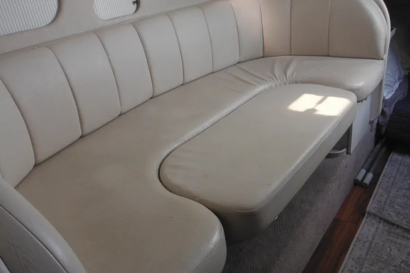 Slide: The Image of Cream leather seating in 2000 Rinker 330 Fiesta Vee boat interior. - 64