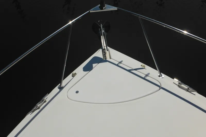Slide: The Image of Bow of 2000 Rinker 330 Fiesta Vee boat with stainless steel railings. - 66