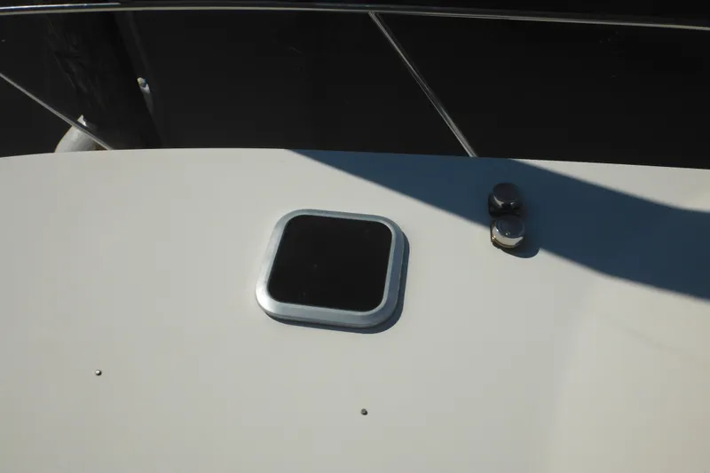 Slide: The Image of Rinker 330 Fiesta Vee 2000 boat deck with hatch and cleat. - 69