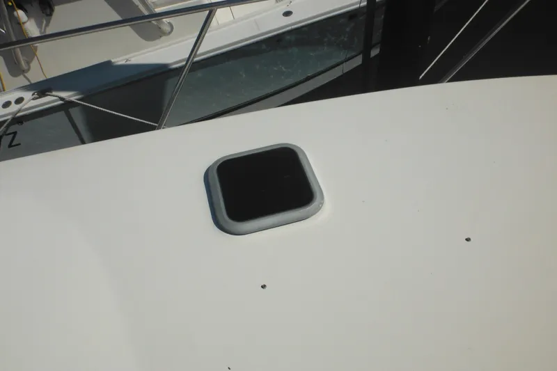 Slide: The Image of Rinker 330 Fiesta Vee 2000 boat deck with a square hatch. - 70