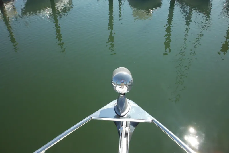 Slide: The Image of Bow view of 2000 Rinker 330 Fiesta Vee reflecting on calm water. - 71