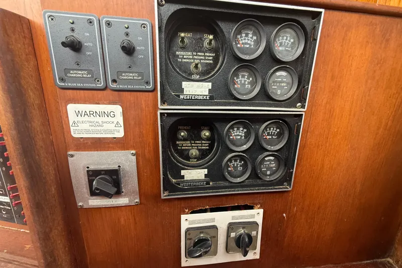 Slide: The Image of Control panel of a 1982 Albin 49 Trawler with gauges and switches. - 15