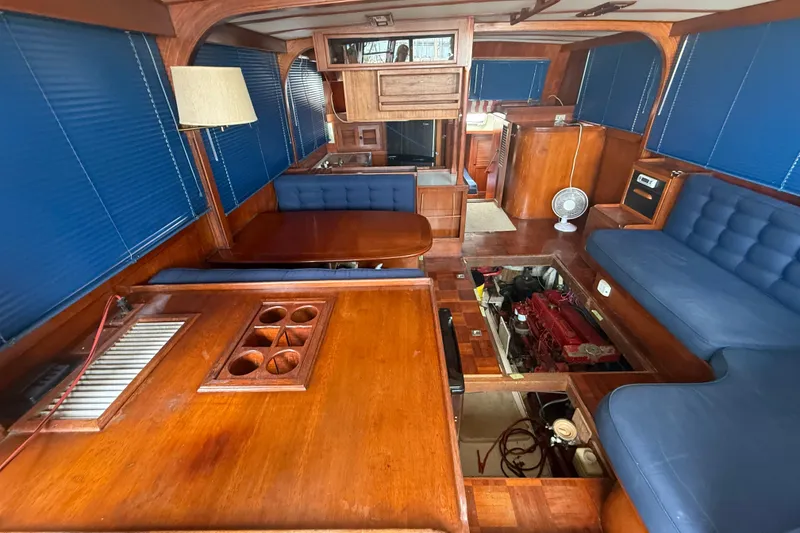 Slide: The Image of Interior of 1982 Albin 49 Trawler with wooden furnishings and blue upholstery. - 21
