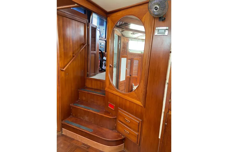 Slide: The Image of Interior of 1982 Albin 49 Trawler with wooden stairs and oval mirror. - 27