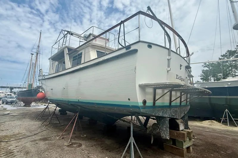 Slide: The Image of 1982 Albin 49 Trawler on dry dock, undergoing maintenance. - 42