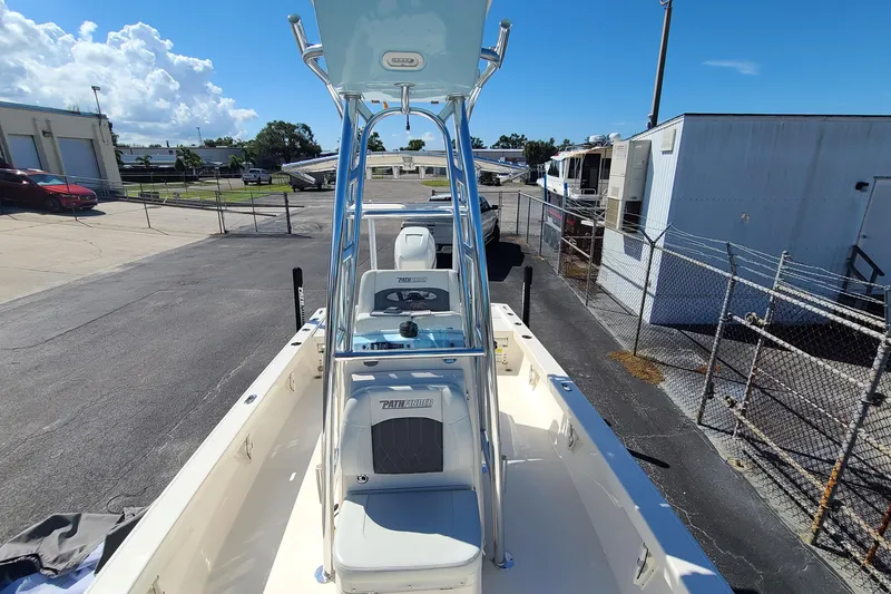 Slide: The Image of 2023 Pathfinder 2500 Hybrid boat, docked outdoors, showcasing sleek design and modern features. - 13