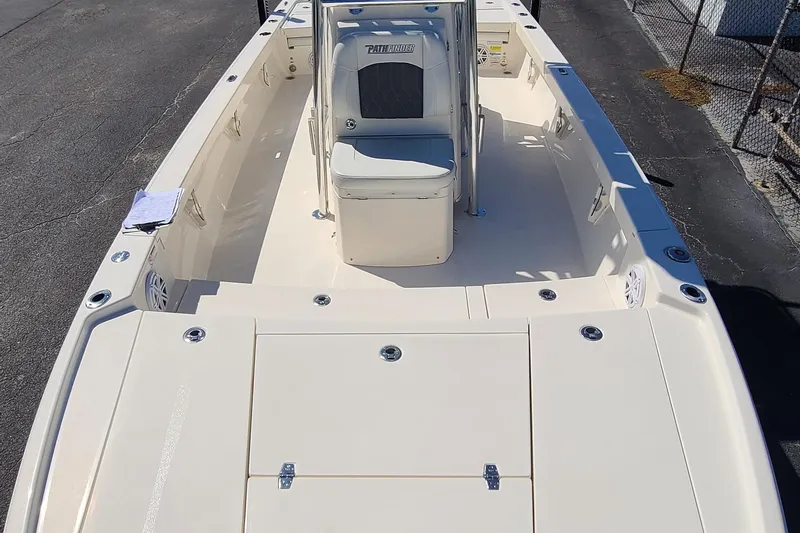 Slide: The Image of 2023 Pathfinder 2500 Hybrid boat interior, featuring spacious deck and seating. - 14