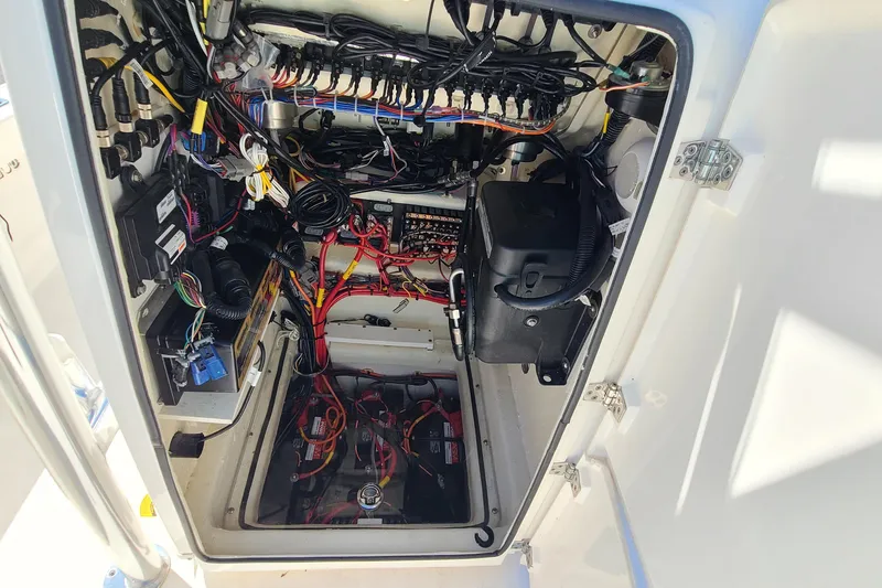 Slide: The Image of 2023 Pathfinder 2500 Hybrid boat electrical compartment with wiring and components. - 16