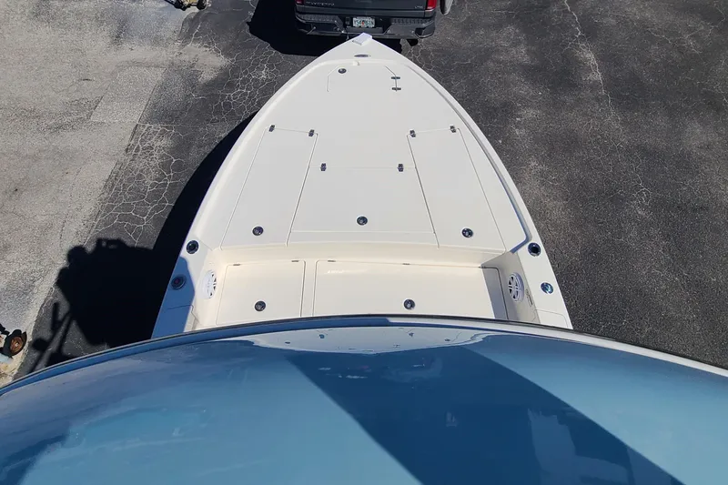 Slide: The Image of Top view of 2023 Pathfinder 2500 Hybrid boat on pavement. - 23