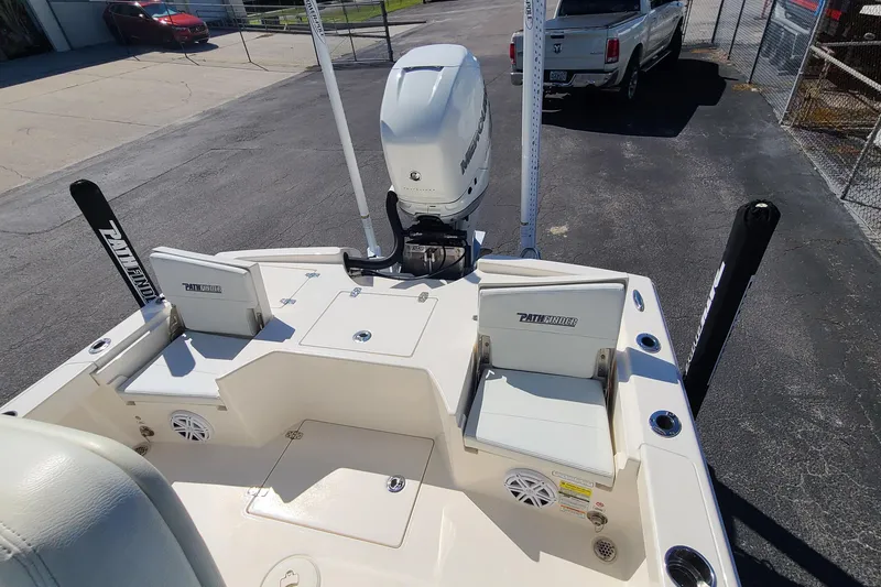 Slide: The Image of 2023 Pathfinder 2500 Hybrid boat with Mercury engine, docked on pavement. - 28