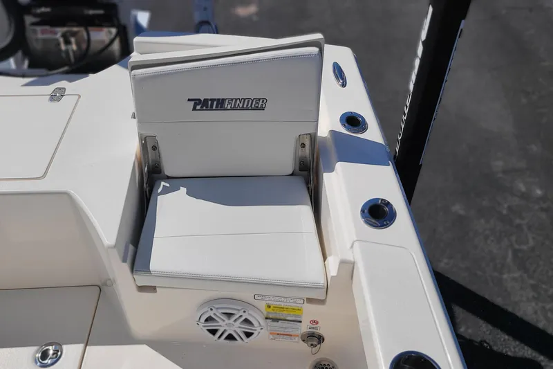 Slide: The Image of 2023 Pathfinder 2500 Hybrid boat seat with logo, cup holders, and speaker. - 29