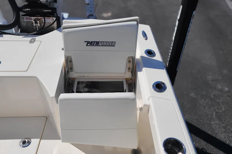 Slide: The Image of 2023 Pathfinder 2500 Hybrid boat with open storage compartment on deck. - 30