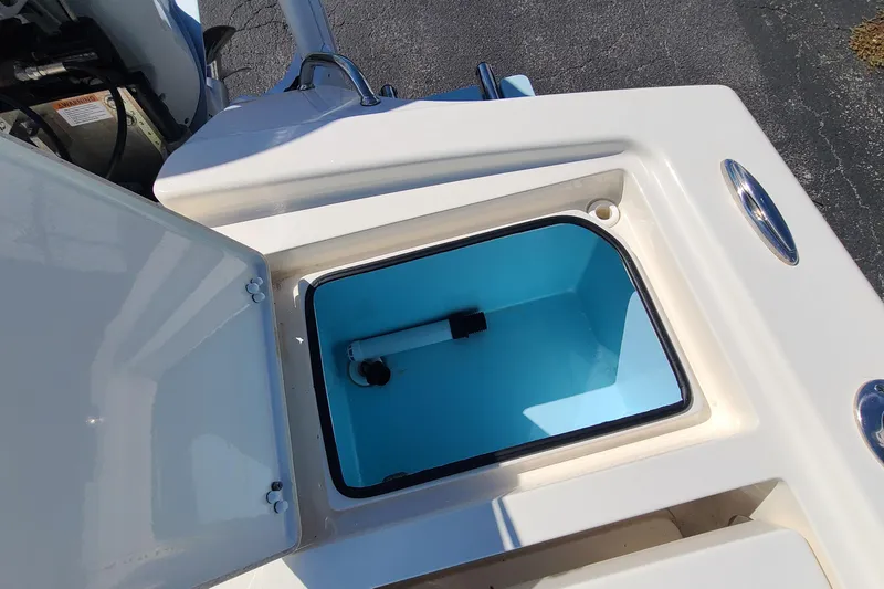 Slide: The Image of Open storage compartment on 2023 Pathfinder 2500 Hybrid boat. - 33
