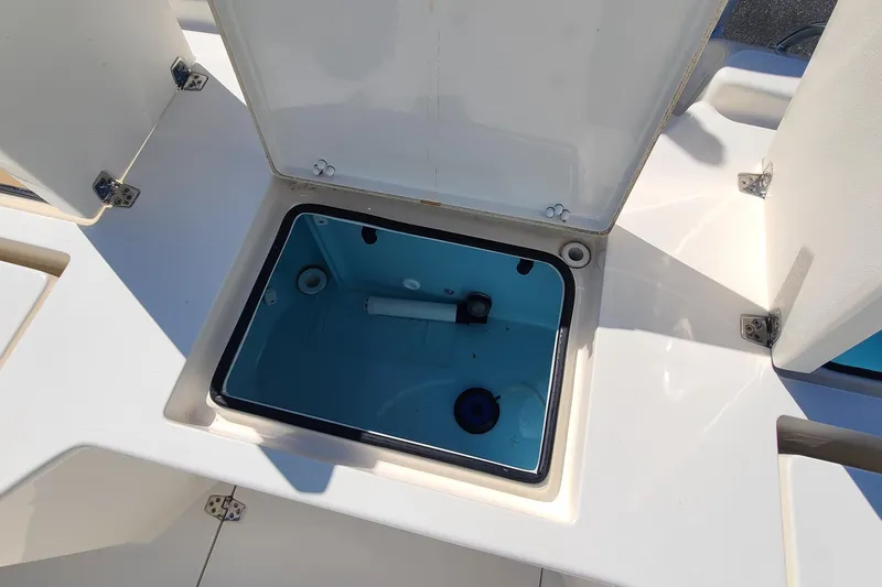 Slide: The Image of Open storage compartment on 2023 Pathfinder 2500 Hybrid boat deck. - 34