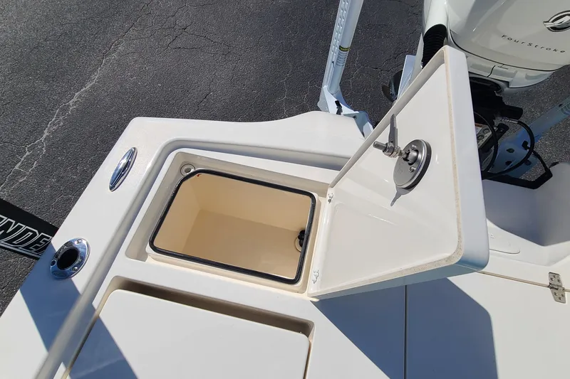 Slide: The Image of Open storage compartment on 2023 Pathfinder 2500 Hybrid boat deck. - 35