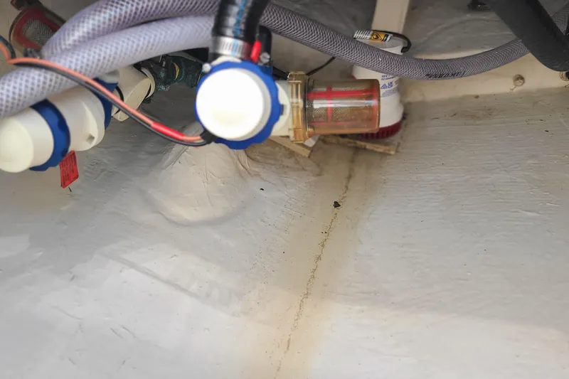 Slide: The Image of Interior view of 2023 Pathfinder 2500 Hybrid boat's plumbing and wiring system. - 37