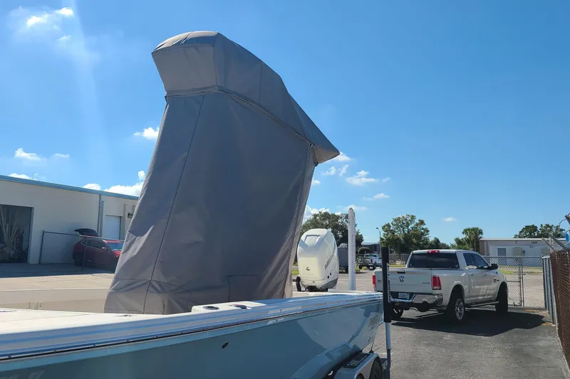 Slide: The Image of 2023 Pathfinder 2500 Hybrid boat with cover in sunny outdoor setting. - 40