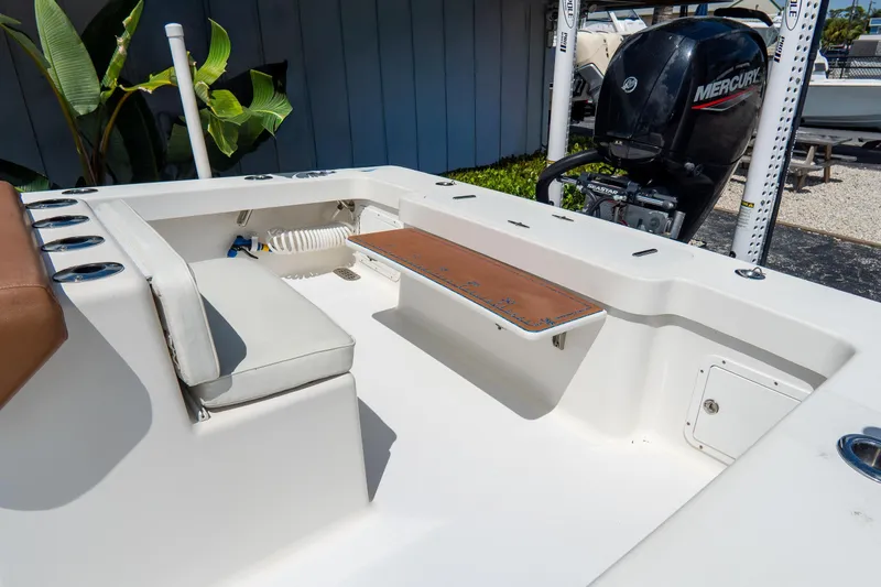 Slide: The Image of 2022 Croswait Custom Carolina 21 boat interior with seating and Mercury outboard motor. - 10