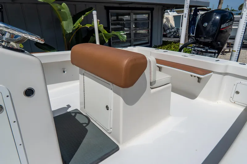Slide: The Image of 2022 Croswait Custom Carolina 21 boat interior with seating and Mercury engine. - 12