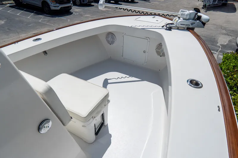 Slide: The Image of 2022 Croswait Custom Carolina 21 boat interior with seating and Minn Kota trolling motor. - 16