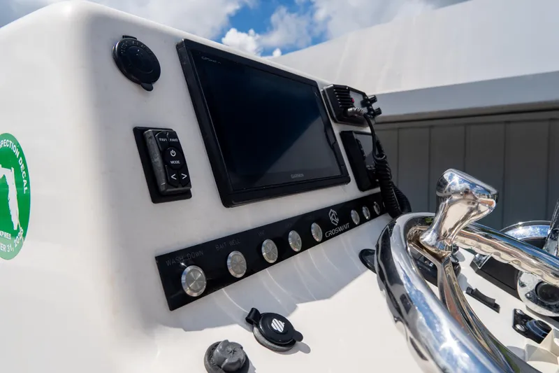 Slide: The Image of Croswait Custom Carolina 21 boat dashboard with controls and navigation screen, 2022 model. - 23