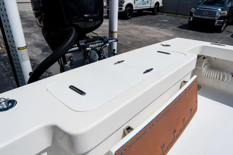 Slide: The Image of 2022 Croswait Custom Carolina 21 boat with SeaStar engine, featuring a sleek white deck. - 27