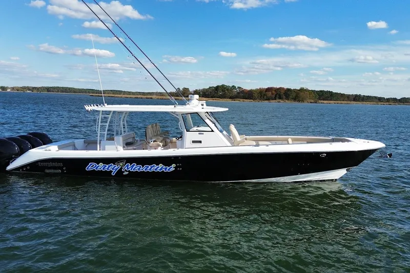 The Image of 2020 Everglades 435 Center Console boat on water, clear sky background. - 0