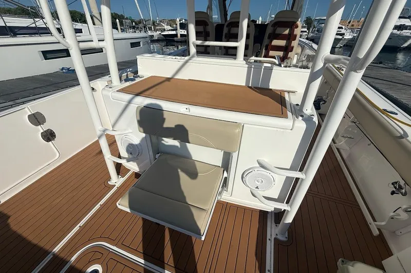 Slide: The Image of Engine compartment of 2020 Everglades 435 Center Console boat, showcasing mechanical components. - 10