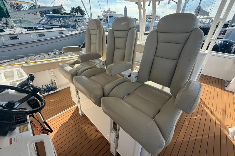 Slide: The Image of 2020 Everglades 435 Center Console boat with luxurious seating on deck. - 15