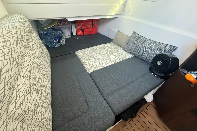 Slide: The Image of Interior cabin of 2020 Everglades 435 Center Console with comfortable seating and windows. - 22