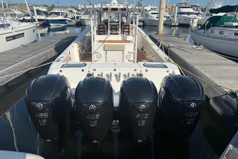 Slide: The Image of 2020 Everglades 435 Center Console boat on water with Yamaha engines. - 3