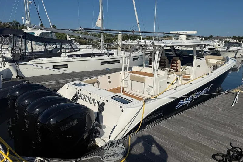 Slide: The Image of 2020 Everglades 435 Center Console boat on water with "Dirty Martini" branding. - 4