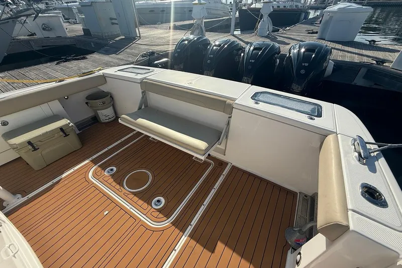 Slide: The Image of 2020 Everglades 435 Center Console boat on open water under blue sky. - 5