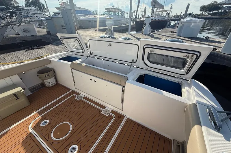 Slide: The Image of Overhead view of 2020 Everglades 435 Center Console boat on water. - 6