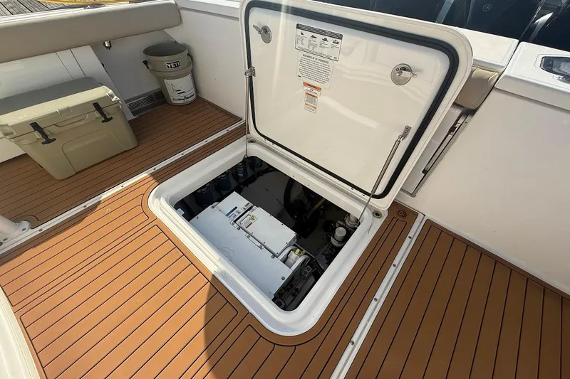 Slide: The Image of 2020 Everglades 435 Center Console with four powerful V8 engines cruising on open water. - 7