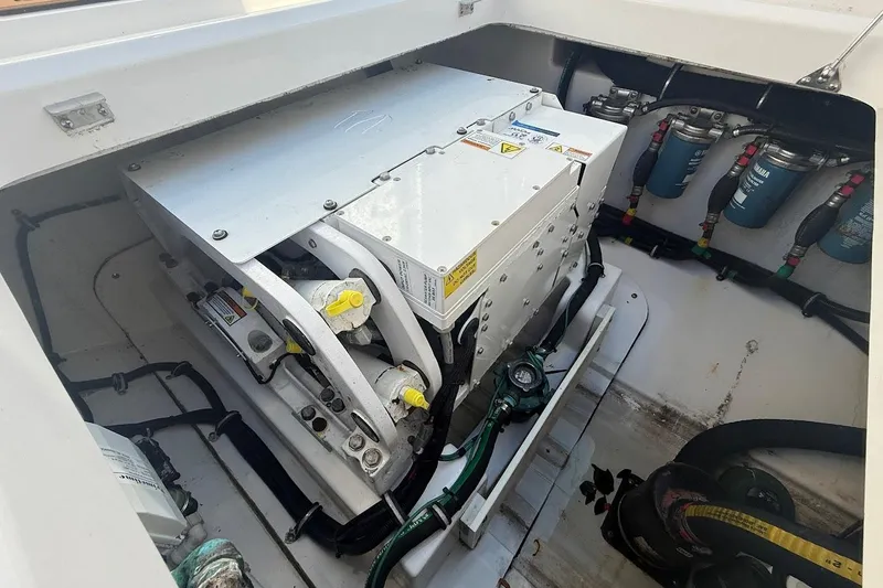 Slide: The Image of 2020 Everglades 435 Center Console boat cruising on open water, featuring spacious deck. - 8