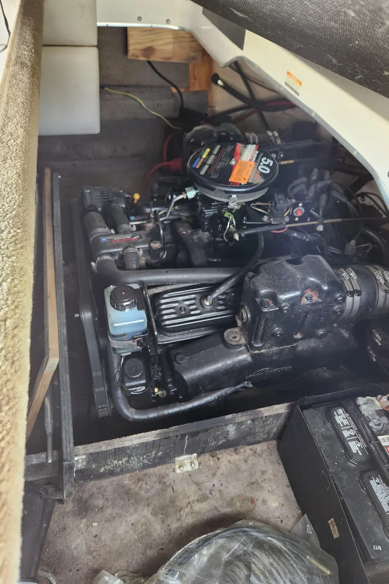 Slide: The Image of 2000 Chaparral 200SSI boat engine compartment with visible engine components. - 3