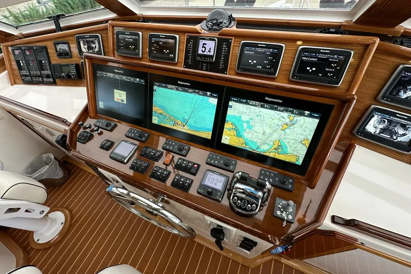 Slide: The Image of Helm of 1998 Viking 54 Motor Yacht with navigation screens and controls. - 17