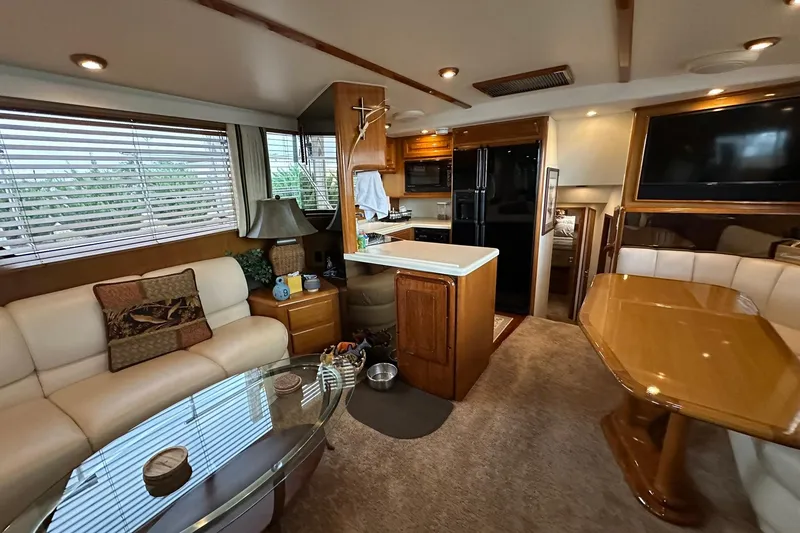 Slide: The Image of Luxurious interior of a 1998 Viking 54 Motor Yacht with modern amenities and elegant furnishings. - 22