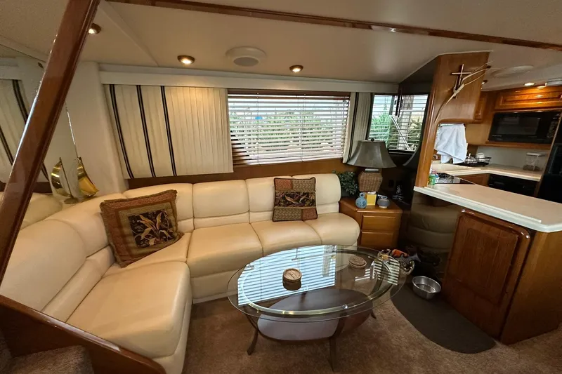 Slide: The Image of Luxurious interior of a 1998 Viking 54 Motor Yacht with elegant seating and modern amenities. - 23