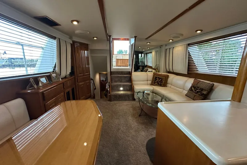 Slide: The Image of Luxurious interior of a 1998 Viking 54 Motor Yacht with elegant furnishings and ample natural light. - 29