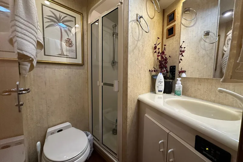 Slide: The Image of Luxurious bathroom in 1998 Viking 54 Motor Yacht with shower, sink, and toilet. - 36